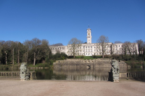 A picture of the Clock tower by a lake in University Park